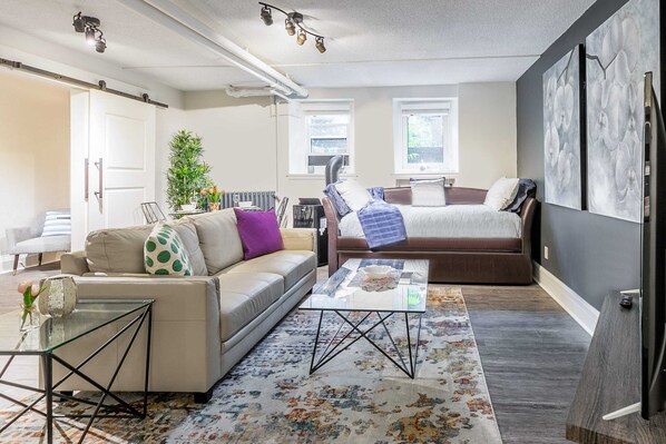 Spacious Living Area With A Comfortable Sofa And Daybed