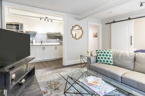 Open Living Space With A View Of The Fully Equipped Kitchen