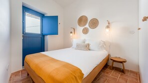 Drift off in a peaceful bedroom with rustic decor and soft lighting, embodying the essence of slow living. #SlowLiving #CozyBedroom