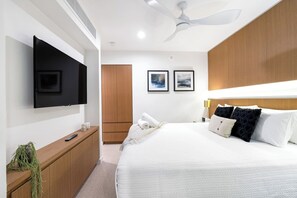 Enjoy the comfort of a restful night's sleep with a king bed and blackout blinds ensuring a peaceful environment.