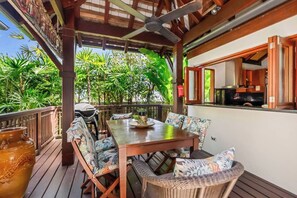 The living and kitchen area extends to a private undercover deck with a ceiling fan to keep things nice and breezy while you dine alfresco.