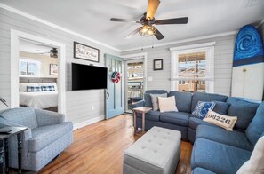 Living room with pull out sofa, smart TV and space to enjoy family 