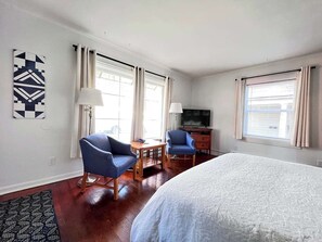 Seating for 2 in front of the picture window, which invites lovely natural light. 
