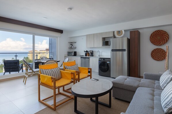 Experience vibrant modern living with stunning sea views just steps from the beach