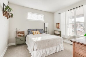 This queen bed is in the downstairs bedroom.