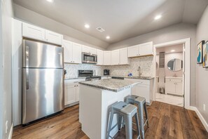 Large fully stocked kitchen with island for two