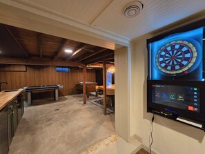 Aim for the bullseye on this awesome dartboard! Keep score with the digital board and enjoy endless fun in our cozy basement retreat.