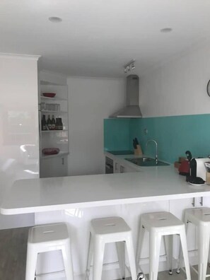  Cook up a feast in the well-equipped kitchen, and enjoy easy dining at the breakfast bar. 
