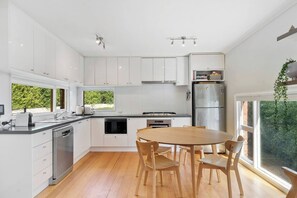 The spacious kitchen makes cooking a breeze with high-quality appliances including a dishwasher for easy cleanup. 
