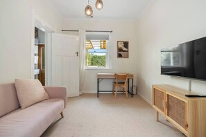 Work or study remotely in the comforts of the second living room furnished with a dedicated workspace. 