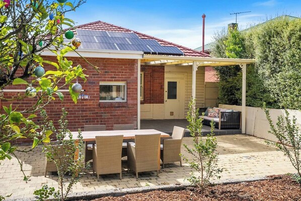 Take in quiet leafy views as you gather and dine alfresco on the paved patio. 
