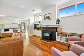 The living and dining area is open plan with air-conditioning and heating to keep things comfortable.
