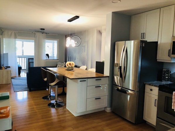 Kitchen/dining/living room. View from the front door.