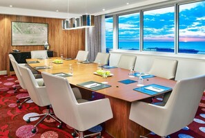 An equipped conference room, perfect place for a meeting!