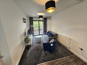 cosy living room with direct access to balcony 