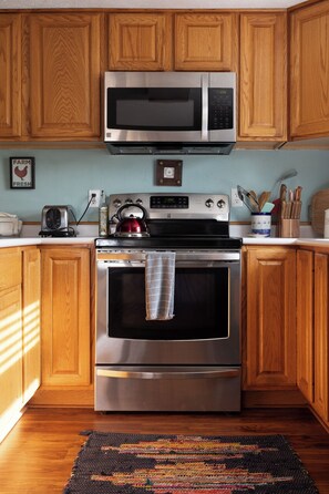 Our well-appointed kitchen with eat-in dining keeps everyone close while enjoying a nice meal.