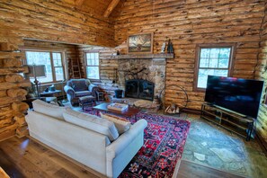 A 65" Samsung Smart TV is the perfect modern amenity for this rustic space.
