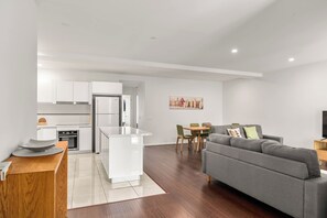 Relax in the open-living area, complete with 2 Smart TV's and unlimited WiFi