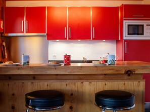 Kitchen, Red, Countertop, Wood, Furniture, Cabinetry, Kitchen Appliance, Flooring, Interior Design, Cupboard