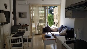 Relax in the open-plan living area, then step out to your private garden retreat