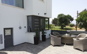 Enjoy al fresco dining on the peaceful patio of this modern Cypriot villa