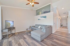 BT825 - Living with TV and sliding doors opening to the screened in balcony