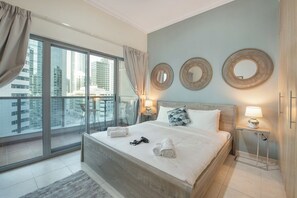 Bedroom with balcony leading off 