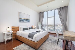 Master bedroom with King size bed, marina view and private bathroom
