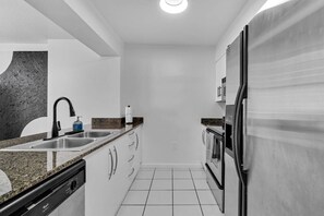 Cook like a pro in the fully stocked kitchen, complete with a dishwasher for easy cleanup.