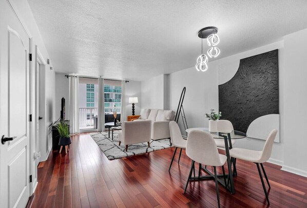 Dine in style at a cozy table, perfect for meals or morning coffee.
