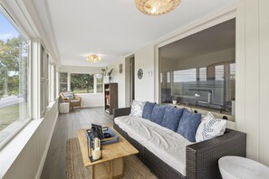 Our unique front porch offers a row of picture windows looking out over the lake.  Enjoy your morning coffee here or play board games with your family and friends.