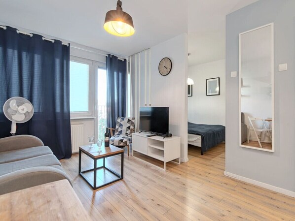 Living room with Smart TV and Balcony | Book Now with RENTUJEMY.COM