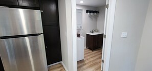 Kitchen and doorway to half bath