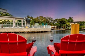 Enjoy a peaceful view across the waterfront, where the charming neighbor’s home adds to the serene and picturesque surroundings.