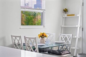 Gather around this cozy 4-person dining table, perfect for enjoying meals 