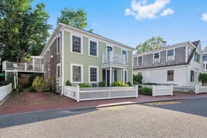 Driveway and two of the three decks exclusive to the top floor condominium