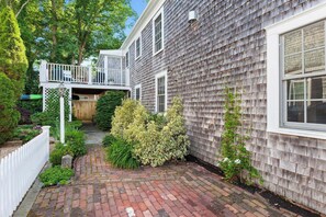 Driveway leading to side entry deck
