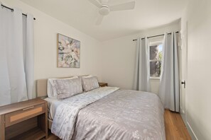 Soft hues and gentle florals paint a picture of serenity in this dreamy bedroom.  Perfect for a peaceful escape. ✨ #cozybedroom