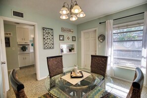 Dine in style in this bright, airy dining room.