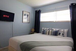 Relax in the calming blue bedroom.