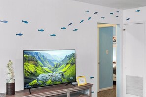 Relax and unwind with a movie night. Enjoy the beachy decor!