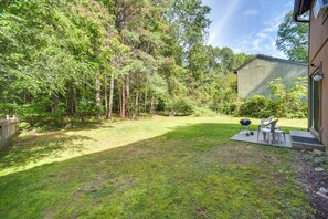 Townhome Exterior | Furnished Patio | Charcoal Grill | Private Yard