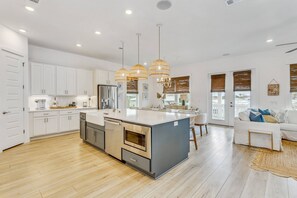 Spacious open concept kitchen with all the necessities to prepare delicious home cooked meals if you choose