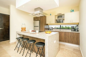 The breakfast bar also serves as a laptop-friendly workspace