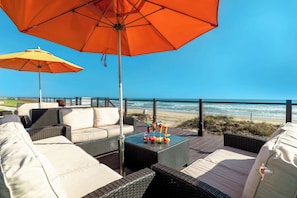 Seaside shaded lounging and dining area
