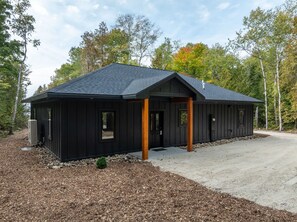 Welcome to Cedar Cove, a serene 4-bedroom, 2-bathroom retreat nestled in the woods of Egg Harbor, WI. This modern, wheelchair-accessible home offers a perfect escape for families, couples, or friends looking for a peaceful Door County getaway.