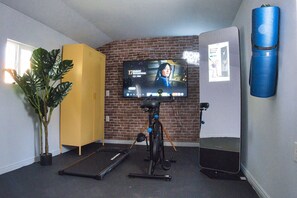 Home Gym, Fitness Facitity with Pro Forma and Treadmill: "Stay on top of your fitness routine in our cutting-edge home gym, equipped with a Peloton bike, treadmill, and everything you need for an invigorating workout."