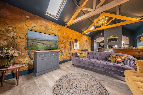 May Cottage + In Focus, Titchwell: Comfortable seating in the living area, with billiards table