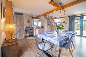 Plumtrees, Thornham: Coastal inspired dining area with garden views and access