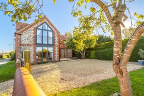 Plumtrees, Thornham: Juliet balcony enjoys stunning vistas across Thornham's saltmarsh to the sea beyond